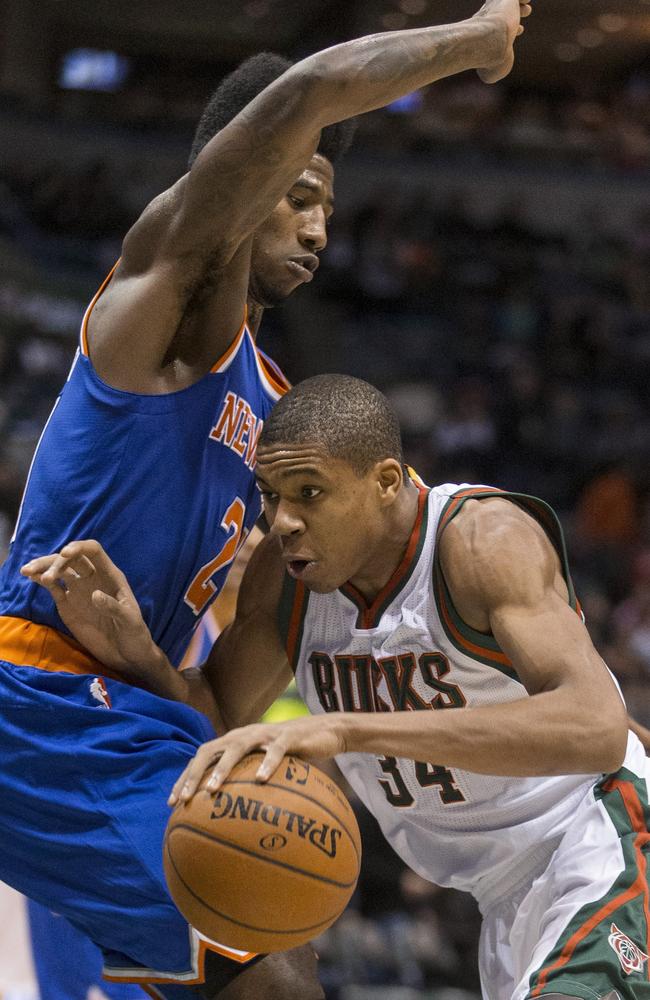 Milwaukee Bucks’ Giannis Antetokounmpo drives against New York’s Iman Shumpert in the Bucks’ win.