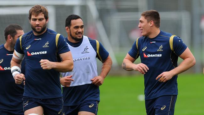 Sean McMahon, right, shares a joke during a Wallabies training session in Cardiff.