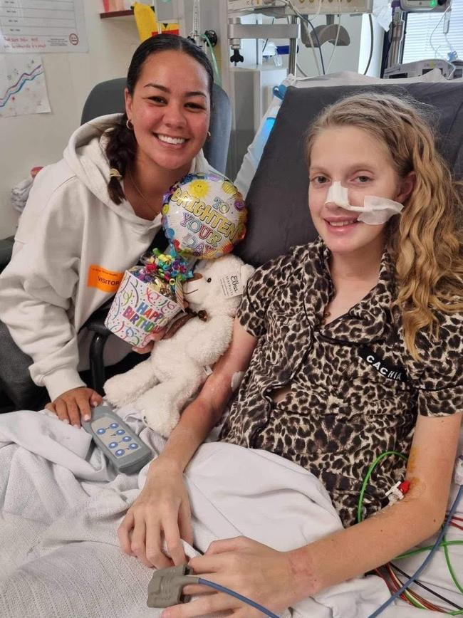 Parramatta and Jillaroos star Kennedy Cherrington with rugby league fan, Ruby. Picture: Supplied