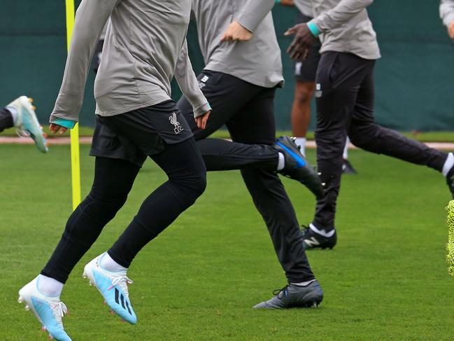 Liverpool's Egyptian midfielder Mohamed Salah (C) joins teammates at a team training session at Melwood in Liverpool, north west England on October 1, 2019, on the eve of their UEFA Champions League Group E football match against FC Salzburg. (Photo by Lindsey Parnaby / AFP)