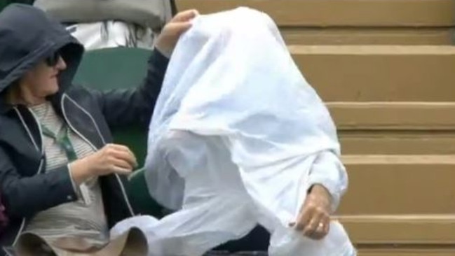 The tennis viewer at one point had one arm through the correct sleeve but still couldn’t figure it out. Image: BBC