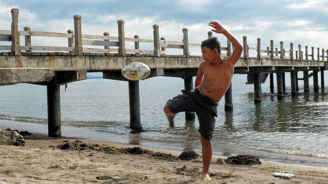 Rob Williams has given the gift of footballs donated by the Ipswich Jets Rugby League Club to kids around the world. Lovina Beach, Bali, Indonesia. Picture: Rob Williams