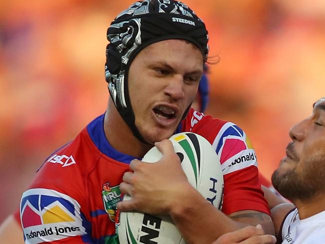 NEWCASTLE, AUSTRALIA - MARCH 09:  Kalyn Ponga of the Knights is tackled during the round one NRL match between the Newcastle Knights and the Manly Sea Eagles at McDonald Jones Stadium on March 9, 2018 in Newcastle, Australia.  (Photo by Tony Feder/Getty Images)