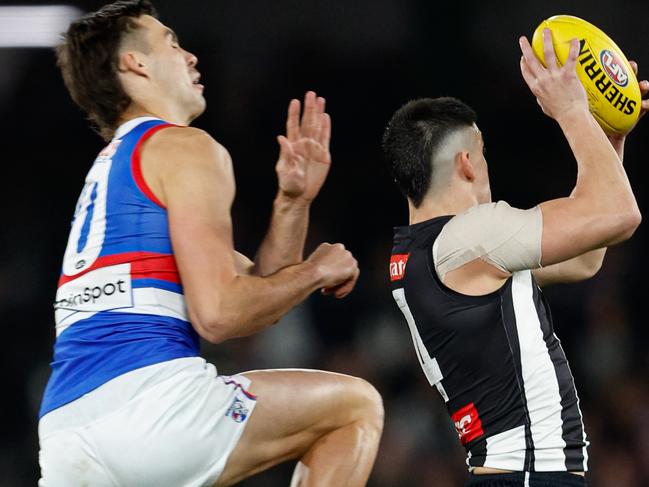 MELBOURNE, AUSTRALIA - MAY 31: Brayden Maynard of the Magpies receives a receives a heavy bump from Sam Darcy of the Bulldogs during the 2024 AFL Round 12 match between the Collingwood Magpies and the Adelaide Crows at The Melbourne Cricket Ground on May 31, 2024 in Melbourne, Australia. (Photo by Dylan Burns/AFL Photos via Getty Images)