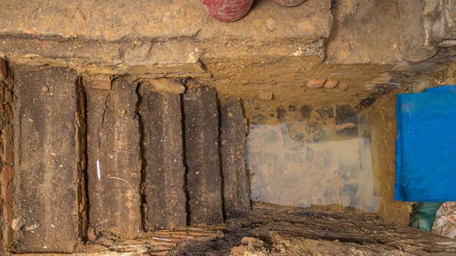 Staircases lead down into the mud with more excavation ahead. Picture: Jason Edwards.