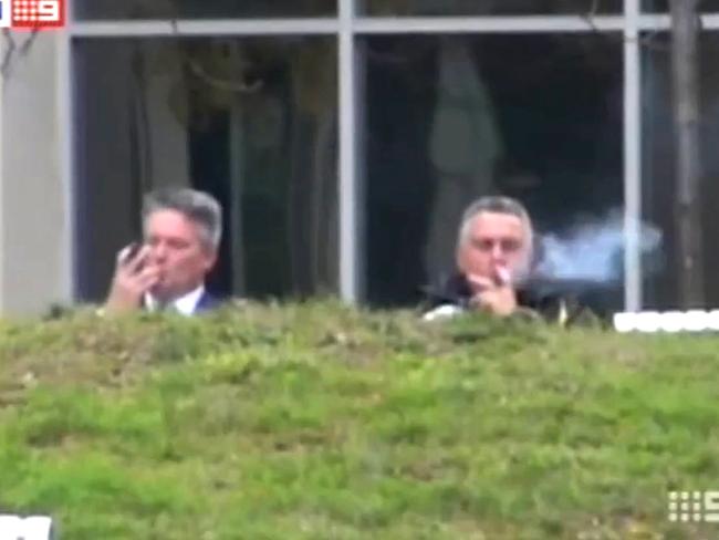 Relax ... Joe Hockey and Finance Minister Matthias Cormann having a smoke in Canberra before the Budget announcement. Picture: Channel 9