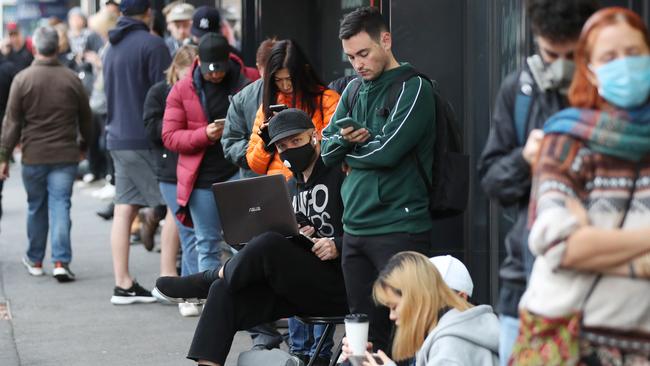 A large queue mounts at the Richmond Centrelink this morning. Picture: David Crosling