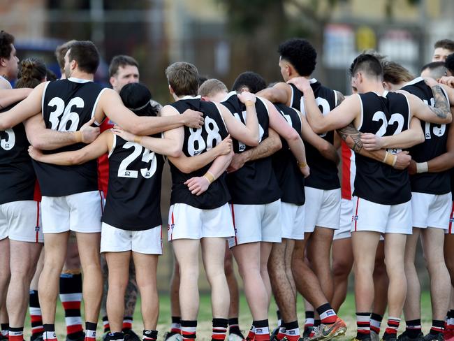 St Kilda City players huddle at a break. Picture: Steve Tanner.