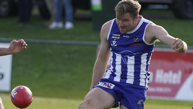 James Longley takes a kick for Langwarrin. Picture: Valeriu Campan