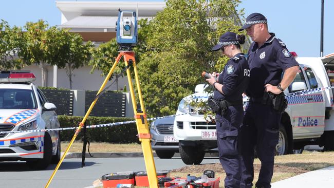 Police officers conducting investigations at the scene. Picture: Glenn Hampson.