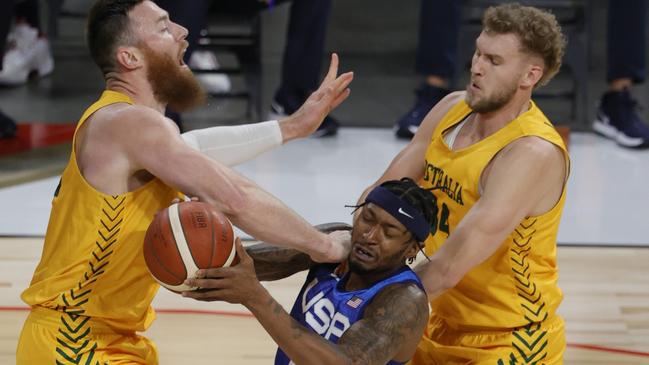The Boomers’ Aron Baynes and Jock Landale try to stop Bradley Beal of Team USA. Picture: Ethan Miller/Getty Images/AFP