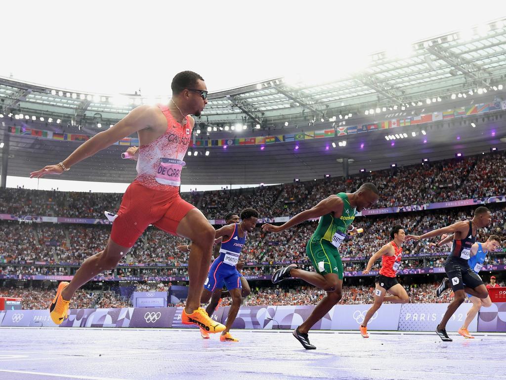 P Andre De Grasse of Team Canada crosses the finish line to win the gold. Picture: Michael Steele/Getty Image