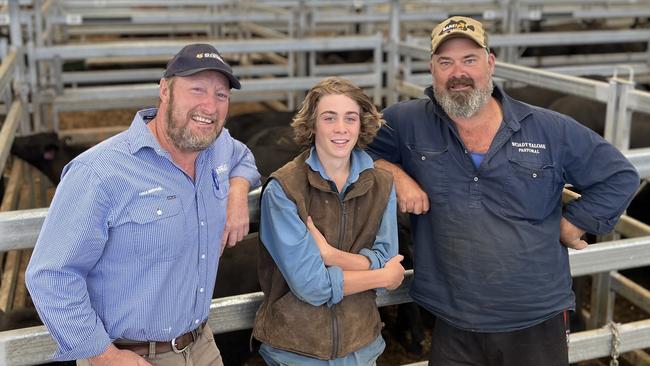 Mark Henry from Snake Valley (far right) sold 12x12 rejoined cows and calves for $4640. He is pictured with agent Grant Daniel of Charles Stewart and family friend Daniel Knight, 17, at the Ballarat F1 female sale last week.