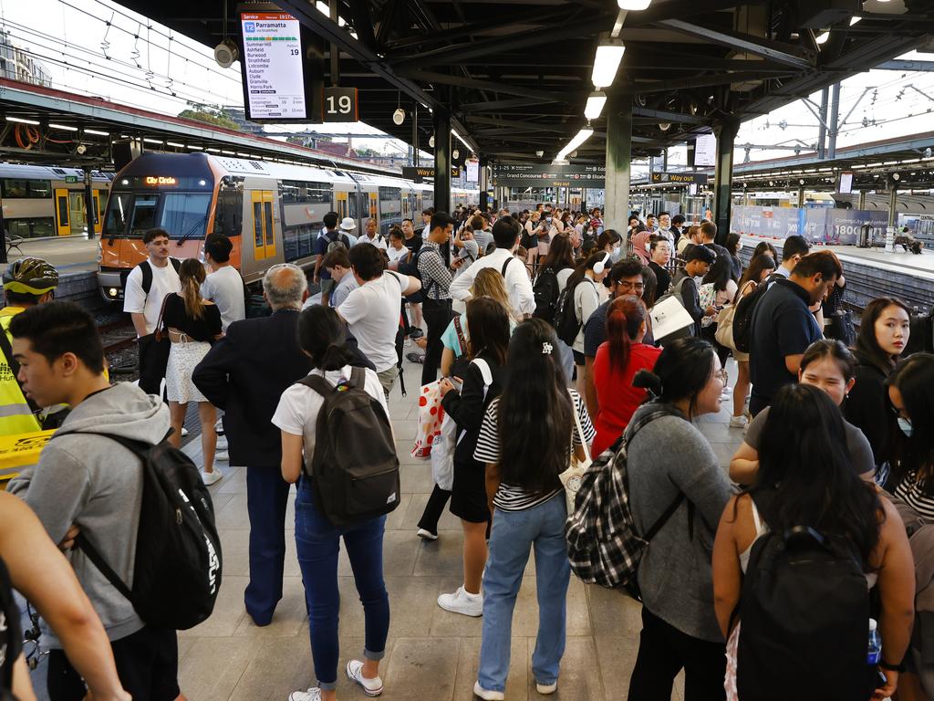 Commuters at Central Station in Sydney waiting to get home after the entire train system went down for an hour at 3.30pm. Picture: Richard Dobson