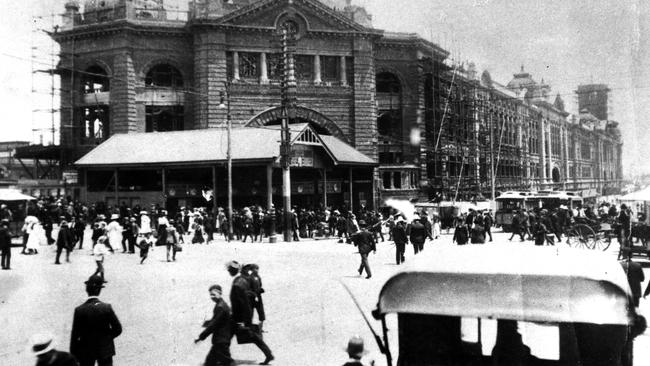 Flinders Street Station under construction, between 1901-1912. The do not spit signs will survive the current $100 million redevelopment.