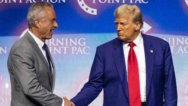 US President Donald Trump shakes hands with Robert F. Kennedy Jr during a campaign rally in October. Picture: AFP