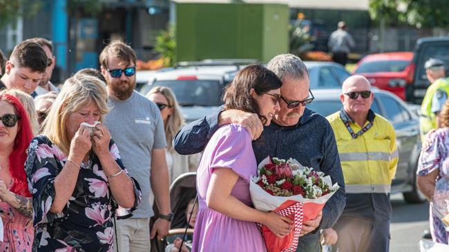 Jeff and Jessica Tougher embrace each other at the floral wall. Picture: NCA NewsWire/ Flavio Brancaleone