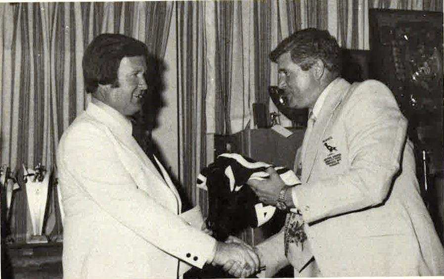 RUGBY LEAGUE SUPPORTER: John Hannay is presented with a Western Suburbs guernsey by secretary of Western Suburbs, Sydney, Gary Russell. Picture: Contributed