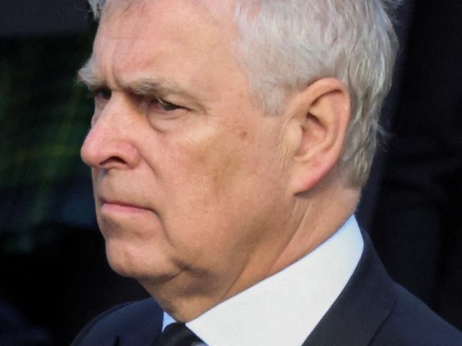 Britain's Prince Andrew walks behind the hearse carrying the coffin of Britain's Queen Elizabeth, in Edinburgh, Scotland, on September 12, 2022. - Mourners will on September 12, 2022 get the first opportunity to pay respects before the coffin of Queen Elizabeth II, as it lies at rest in an Edinburgh cathedral where King Charles III will preside over a vigil. (Photo by PHIL NOBLE / POOL / AFP)