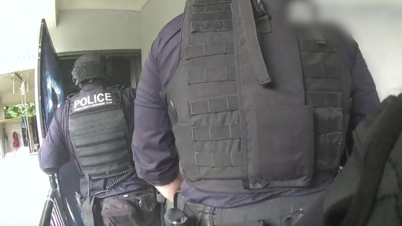 Dramatic footage from Flanagan’s arrest shows Queensland Police Service Public Safety Response Team storm his Morningside unit on Wednesday. Picture: Queensland Police