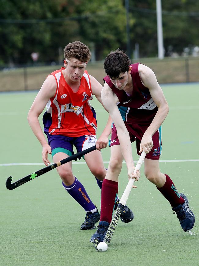 Cairns Hockey. Stingers v Brothers on Reef Turf. Stingers' Mitchel Barber and Brothers' Nathan Winkel. PICTURE: STEWART McLEAN