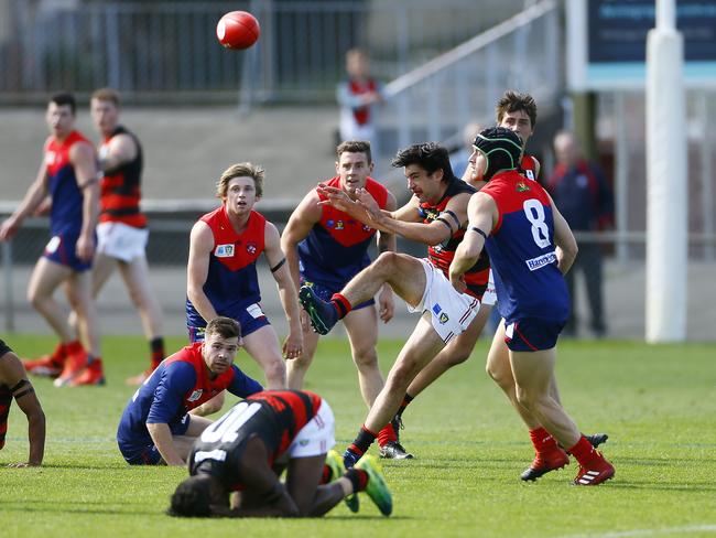 Alex Hevey of Lauderdale gets the ball away in Saturday’s North Hobart V Lauderdale match at North Hobart Oval.  Picture: MATT THOMPSON