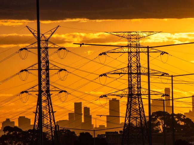 Power line stock image, high voltage electricity. Sunset over Melbourne City skyline looking West from Mayfield Park, Mount Waverley. Picture: Jason Edwards