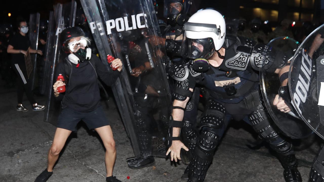 Atlanta police clash with a demonstrator during a protest in Atlanta. Picture: AP/John Bazemore