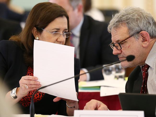 Queensland Premier Annastacia Palaszczuk speaks with Chief of staff David Barbagallo during estimate hearings at Queensland Parliament in Brisbane, Tuesday, July 23, 2019. (AAP Image/Jono Searle) NO ARCHIVING