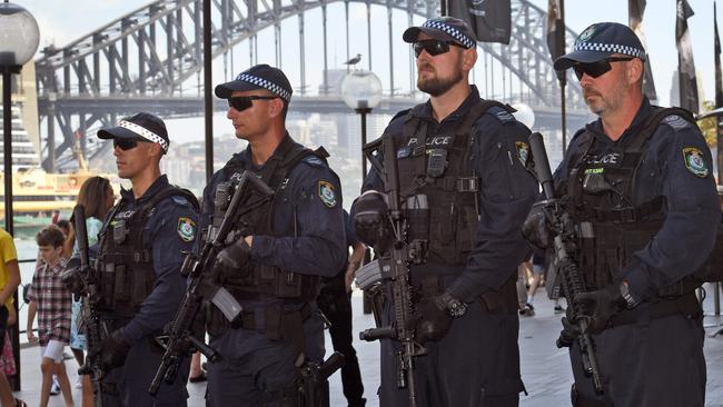 Public Order and Riot Squad officers patrol Circular Quay with rifles. Picture: AFP