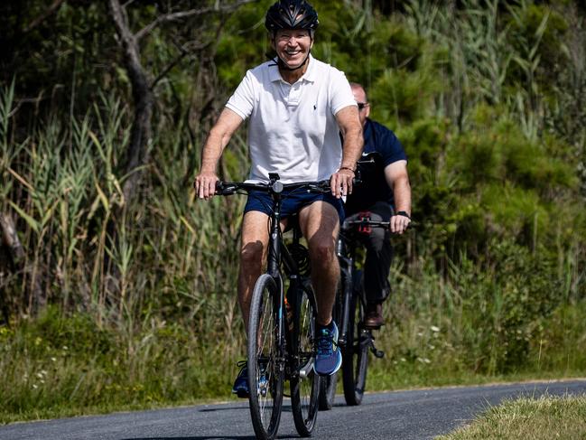 US President Joe Biden rides his bike through Gordons Pond State Park in Rehoboth Beach, Delaware on August 11. Picture: AFP