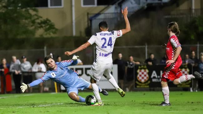 Gold Coast Knights goalkeeper Josh Langdon saves Nishan Velupillay's shot in FFA Cup match v Melbourne Victory at Croatian Sports Park. Picture: Mons Photography