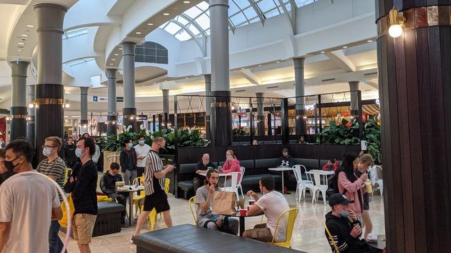 Customers in Eastland's food court, March 2021.