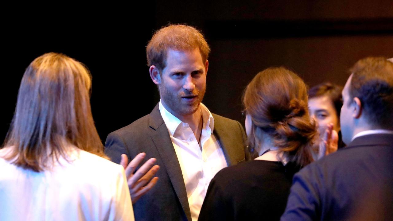 Prince Harry appeared in good spirits as he spoke to delegates at the summit. Picture: AFP/ Andrew Milligan