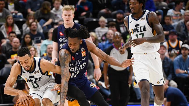 Utah’s Nigel Williams-Goss and Adelaide’s Eric Griffin scrap for the ball at Vivint Smart Home Arena. Picture: Alex Goodlett/Getty Images