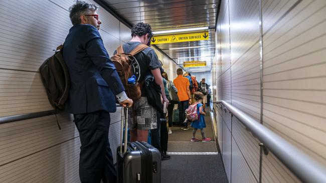 Passengers wait to board their flight at Ronald Regan Washington National Airport last week. Picture: AFP