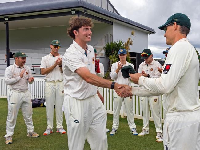 Sam Heazlett presenting Redlands young gun Lachlan McClure his Tigers baggy green earlier this year when making his first grade debut.