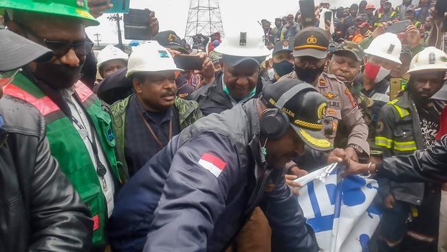 Freeport gold mine workers block a road on Friday. Picture: AFP