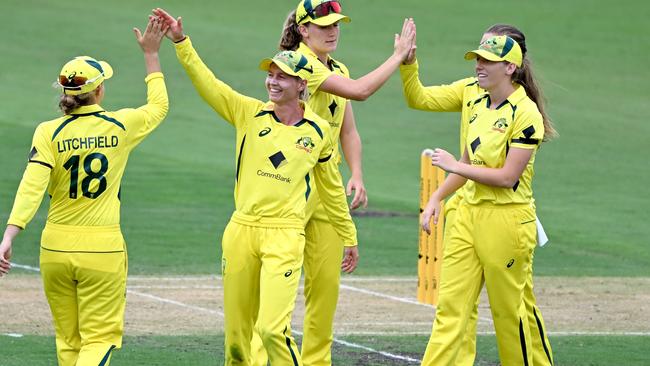 BRISBANE, AUSTRALIA - JANUARY 16: Meg Lanning and Jess Jonassen of Australia celebrate taking the wicket of Fatima Sana of Pakistan during game one of the Womens One Day International series between Australia and Pakistan at Allan Border Field on January 16, 2023 in Brisbane, Australia. (Photo by Bradley Kanaris/Getty Images)