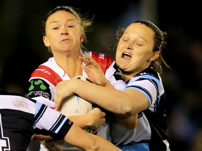Alicia-Kate Hawke of the Dragons is tackled during the Cronulla Sharks v St George Illawarra Dragons womens 9's rugby league game at Shark Park. pic Mark Evans