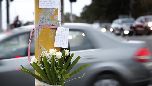 A flower tribute to Aivy Nguyen who was tragically killed at the intersection last year. Picture: David Caird