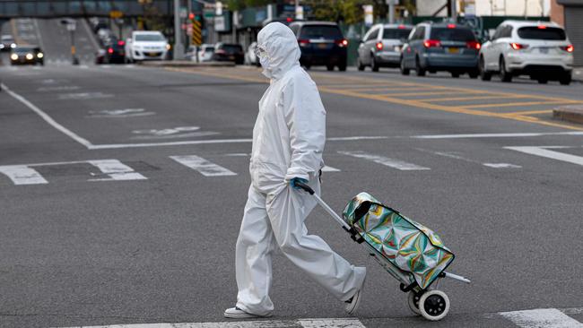 A woman heads out to her grocery shopping in Queens, a borough of New York City, in April. Picture: AFP