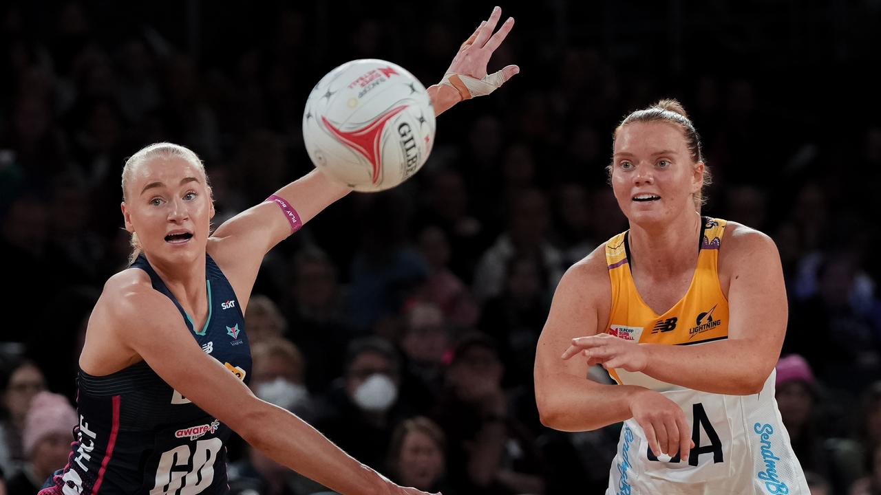 Steph Fretwell passes the ball as Jo Weston of the Melbourne Vixens attempts to block. Picture: Asanka Ratnayake/Getty Images.