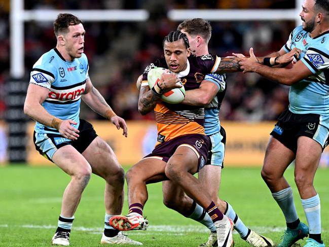 BRISBANE, AUSTRALIA - JUNE 08: TristanÃ&#130;Â Sailor of the Broncos is tackled during the round 14 NRL match between Brisbane Broncos and Cronulla Sharks at Suncorp Stadium, on June 08, 2024, in Brisbane, Australia. (Photo by Bradley Kanaris/Getty Images)