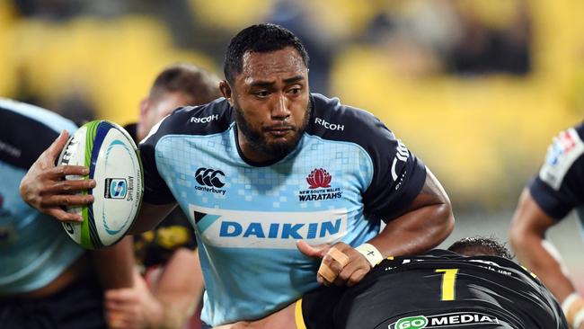 Sekope Kepu of the Waratahs is tackled by Ben May of the Hurricanes.