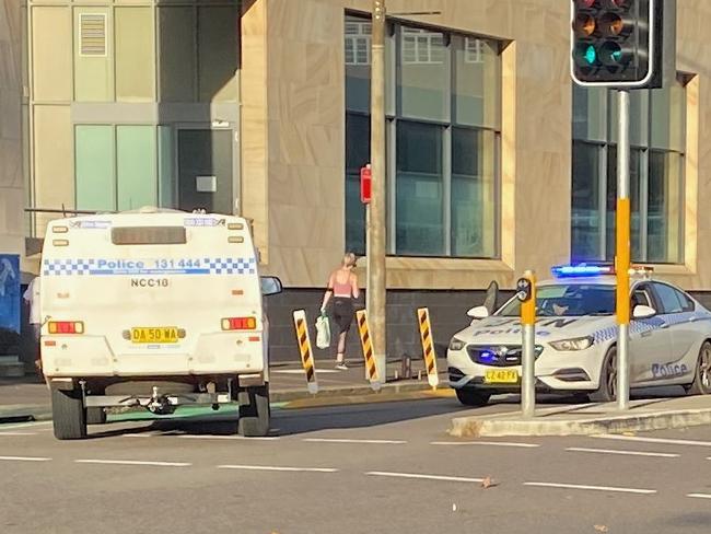 Police at the intersection of Hunter Street and Steel Street at Newcastle West after arresting an armed robbery suspect on March 9, 2022. Picture: Peter Lorimer