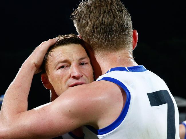 ADELAIDE, AUSTRALIA - SEPTEMBER 10: Jack Ziebell of the Kangaroos hugs Brent Harvey of the Kangaroos after his final game for the club during the 2016 AFL First Elimination Final match between the Adelaide Crows and the North Melbourne Kangaroos at the Adelaide Oval on September 10, 2016 in Adelaide, Australia. (Photo by Adam Trafford/AFL Media/Getty Images)