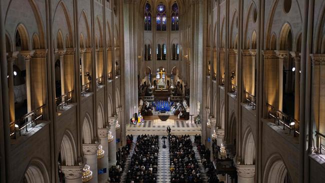 Guests attend a ceremony to mark the re-opening of the landmark Notre-Dame cathedral. Picture: AFP