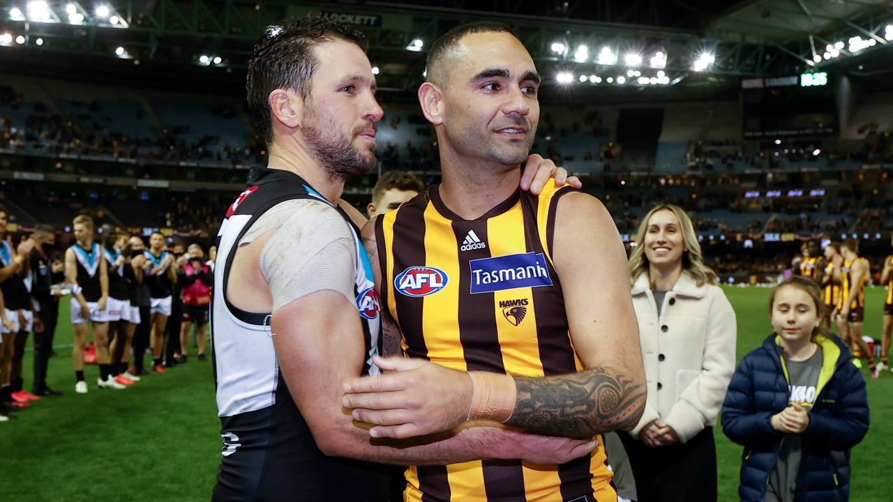 Shaun Burgoyne is embraced by Travis Boak after his 400th game.