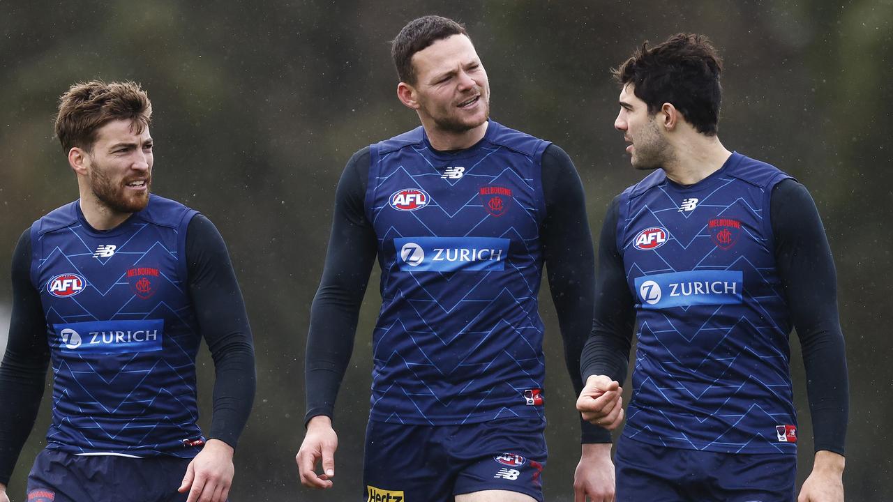 Steven May (centre) at Melbourne training with Jack Viney (left) and Christian Petracca. Picture: Daniel Pockett/Getty Images